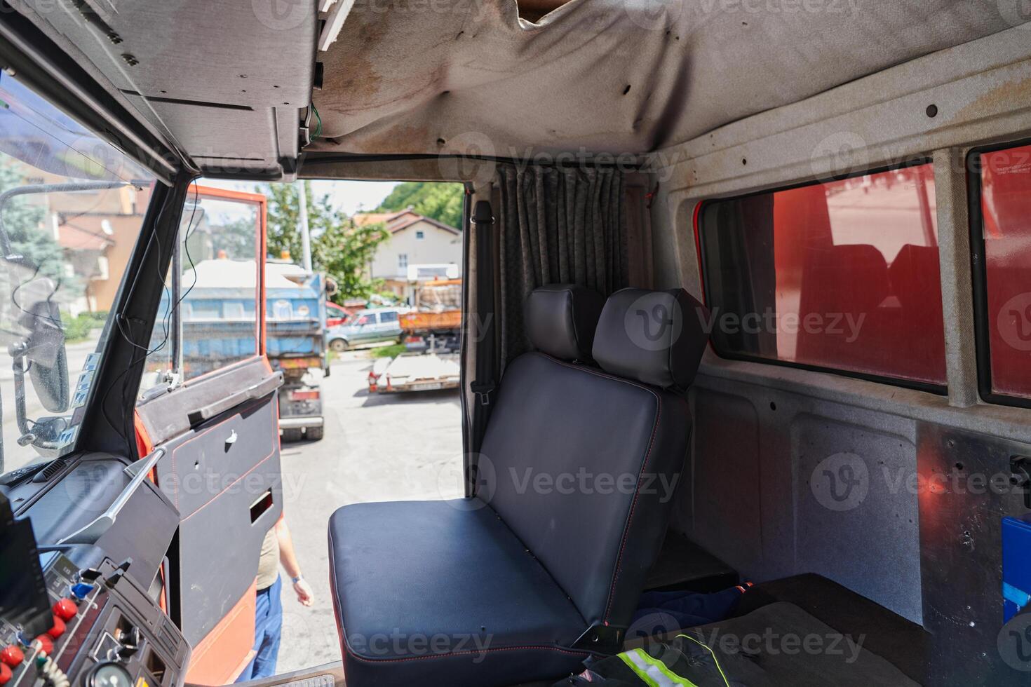 The close-up capture reveals the intricate details of the ergonomic seats and high-tech interior of a modern firefighting truck, showcasing a perfect blend of functionality and safety features photo