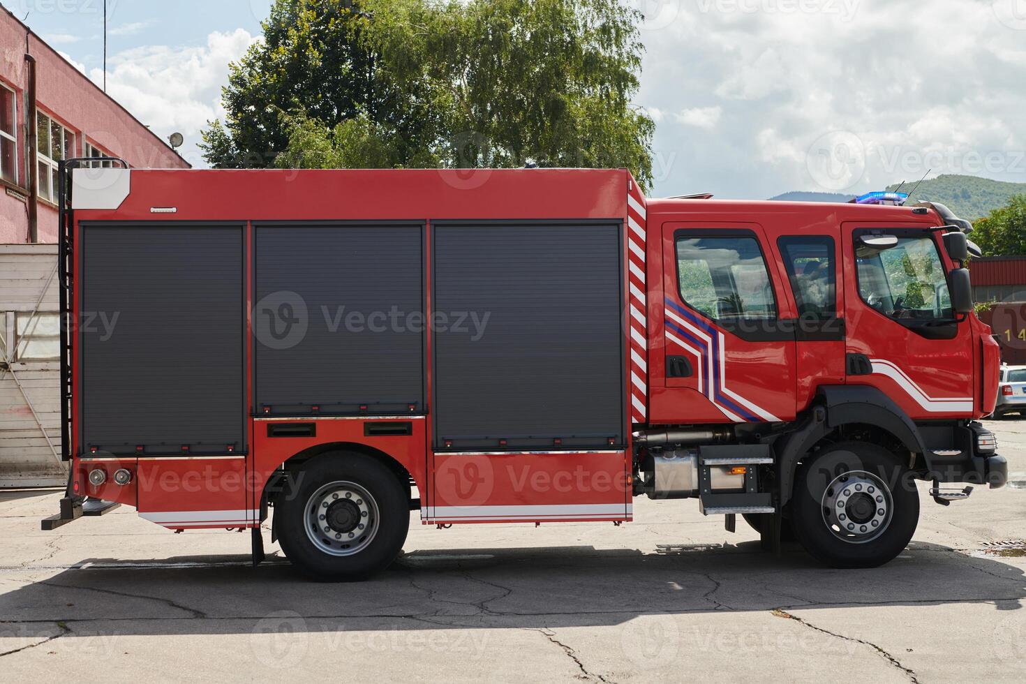 A state-of-the-art firetruck, equipped with advanced rescue technology, stands ready with its skilled firefighting team, prepared to intervene and respond rapidly to emergencies, ensuring the safety photo