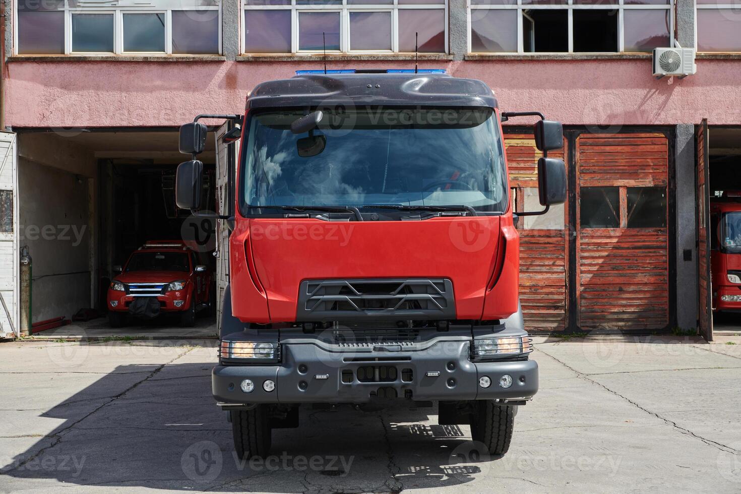 A state-of-the-art firetruck, equipped with advanced rescue technology, stands ready with its skilled firefighting team, prepared to intervene and respond rapidly to emergencies, ensuring the safety photo
