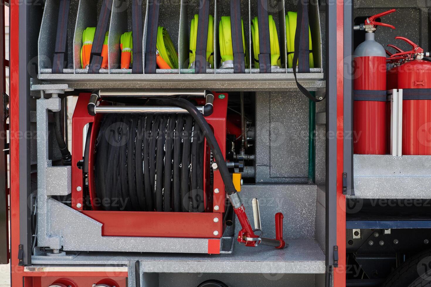 Close-up of essential firefighting equipment on a modern firetruck, showcasing tools and gear ready for emergency response to hazardous fire situations photo