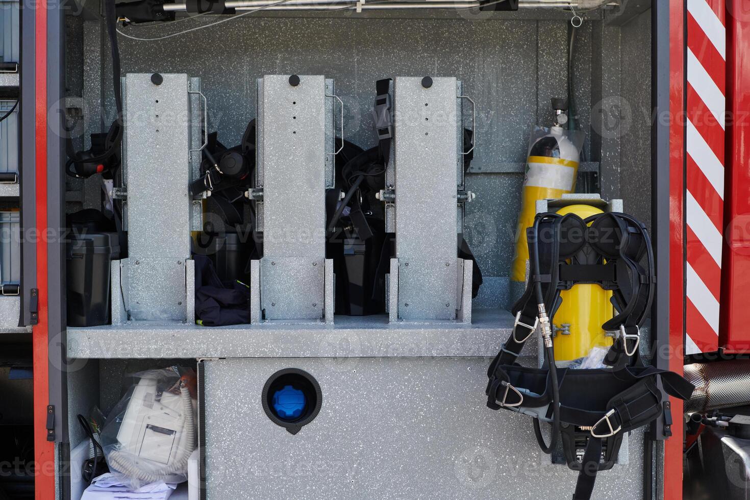 Close-up of essential firefighting equipment on a modern firetruck, showcasing tools and gear ready for emergency response to hazardous fire situations photo