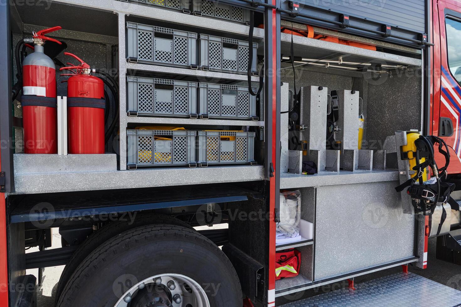 Close-up of essential firefighting equipment on a modern firetruck, showcasing tools and gear ready for emergency response to hazardous fire situations photo