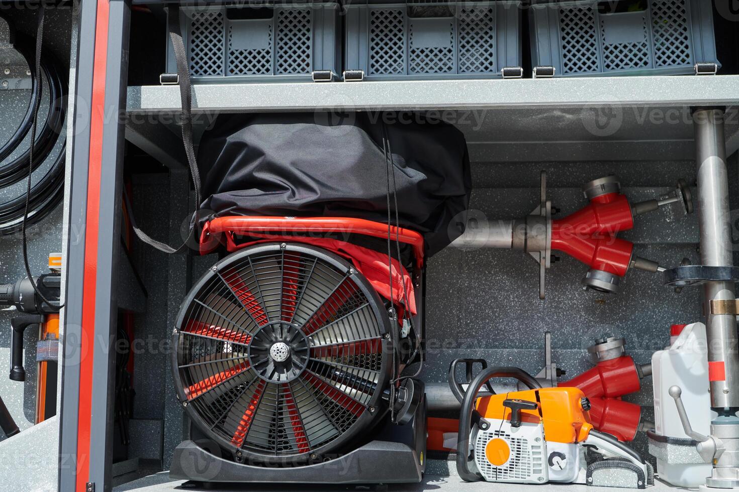 Close-up of essential firefighting equipment on a modern firetruck, showcasing tools and gear ready for emergency response to hazardous fire situations photo