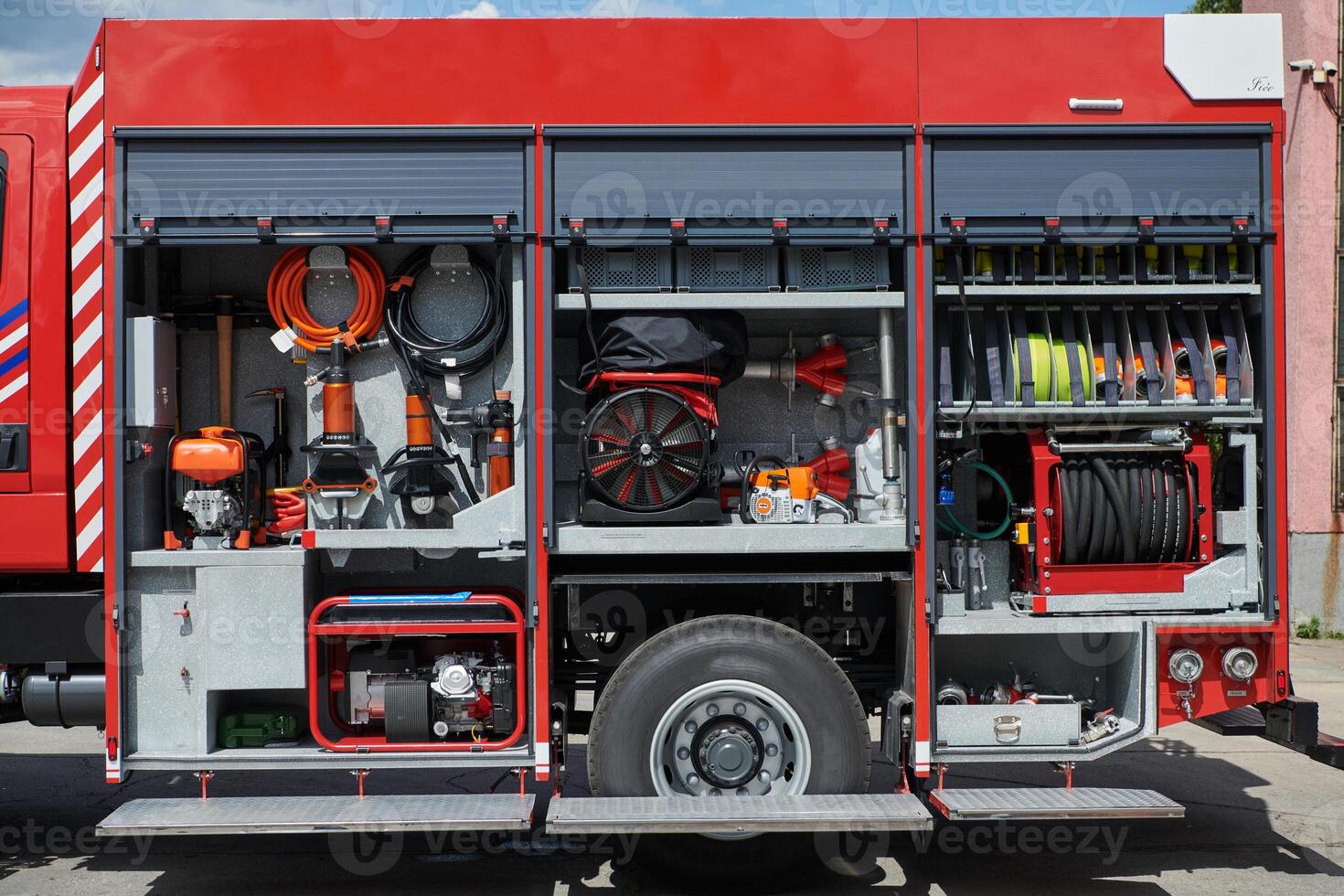 Close-up of essential firefighting equipment on a modern firetruck, showcasing tools and gear ready for emergency response to hazardous fire situations photo