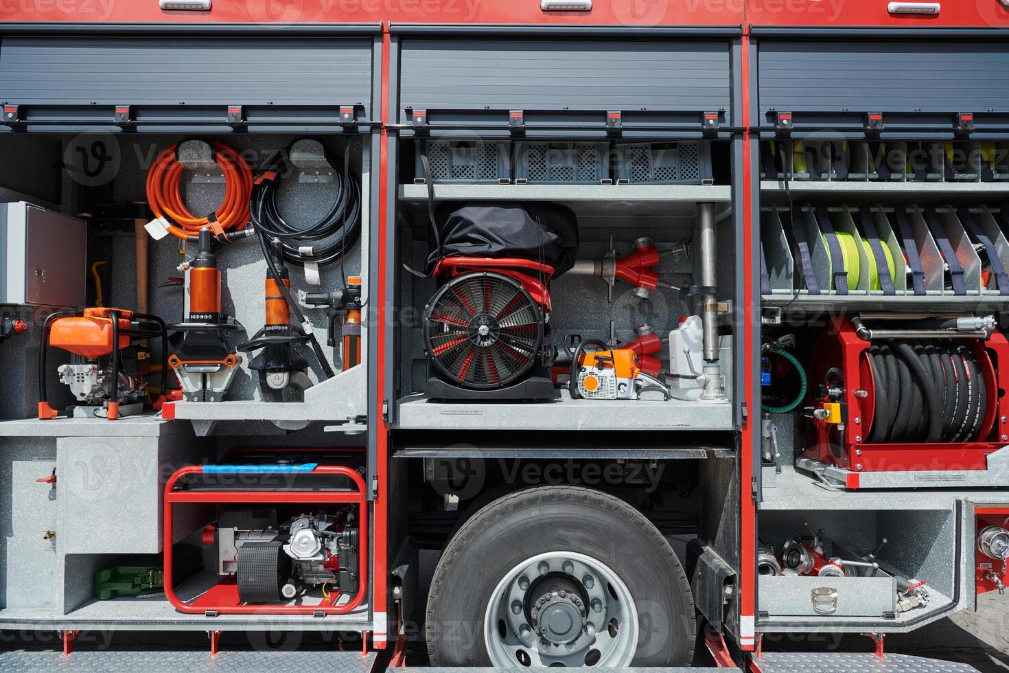 Close-up of essential firefighting equipment on a modern firetruck, showcasing tools and gear ready for emergency response to hazardous fire situations photo