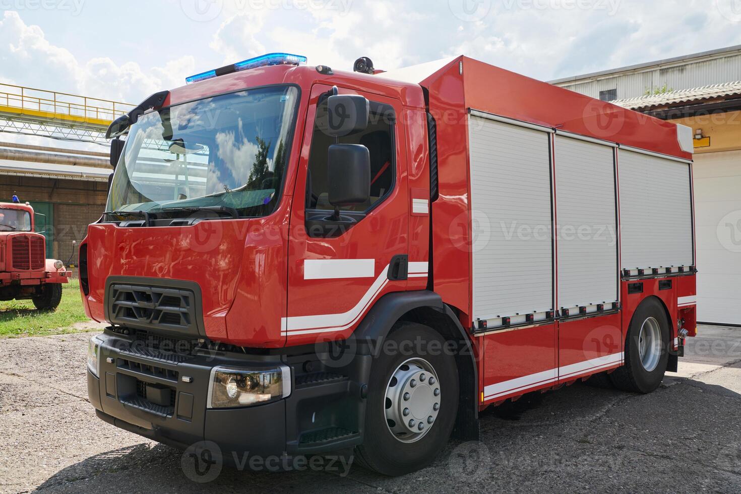 A state-of-the-art firetruck, equipped with advanced rescue technology, stands ready with its skilled firefighting team, prepared to intervene and respond rapidly to emergencies, ensuring the safety photo