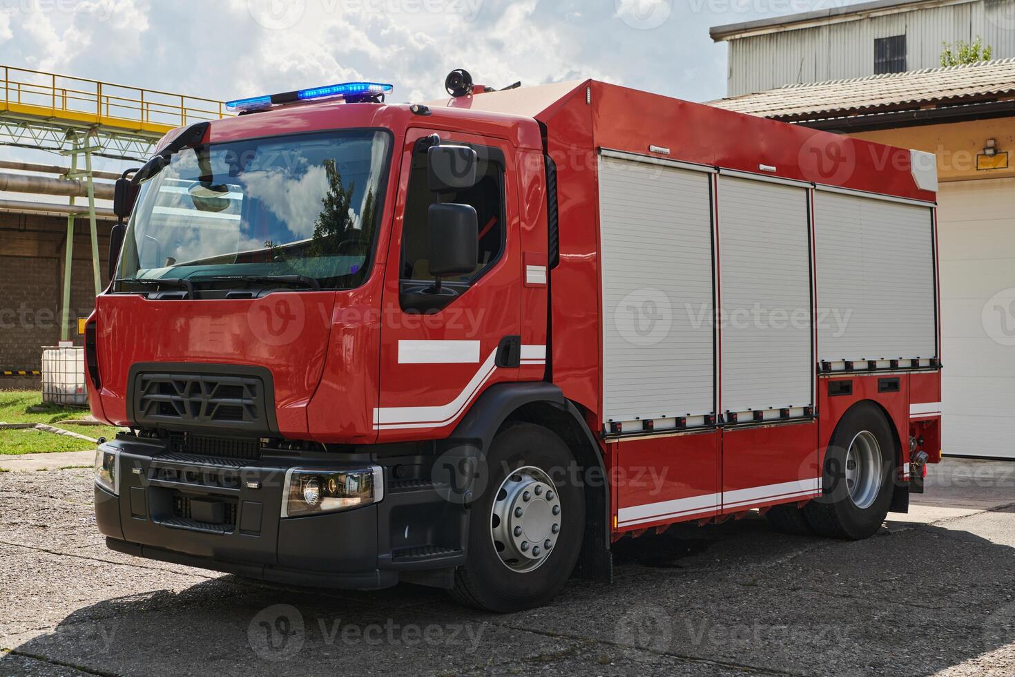 A state-of-the-art firetruck, equipped with advanced rescue technology, stands ready with its skilled firefighting team, prepared to intervene and respond rapidly to emergencies, ensuring the safety photo