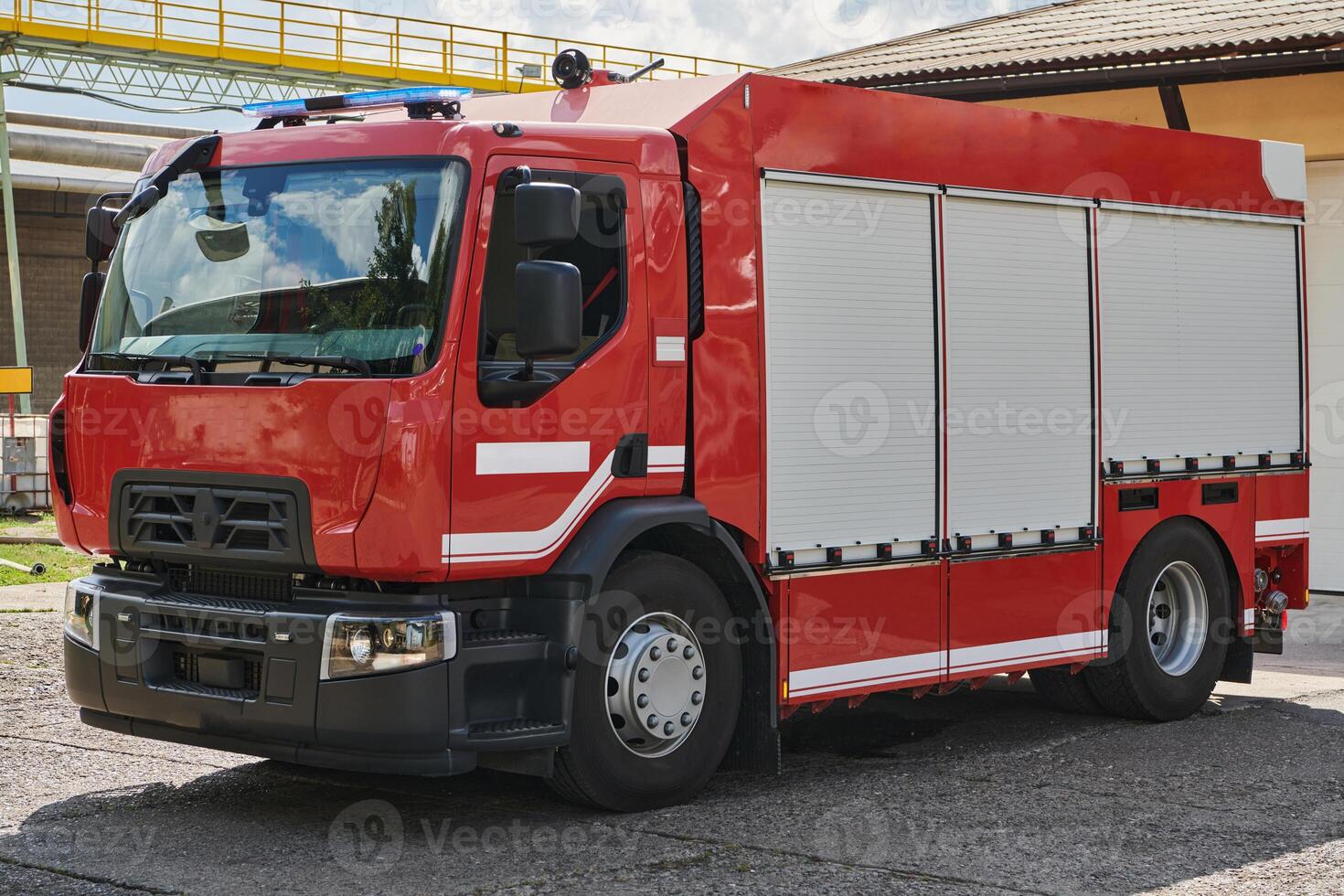 A state-of-the-art firetruck, equipped with advanced rescue technology, stands ready with its skilled firefighting team, prepared to intervene and respond rapidly to emergencies, ensuring the safety photo