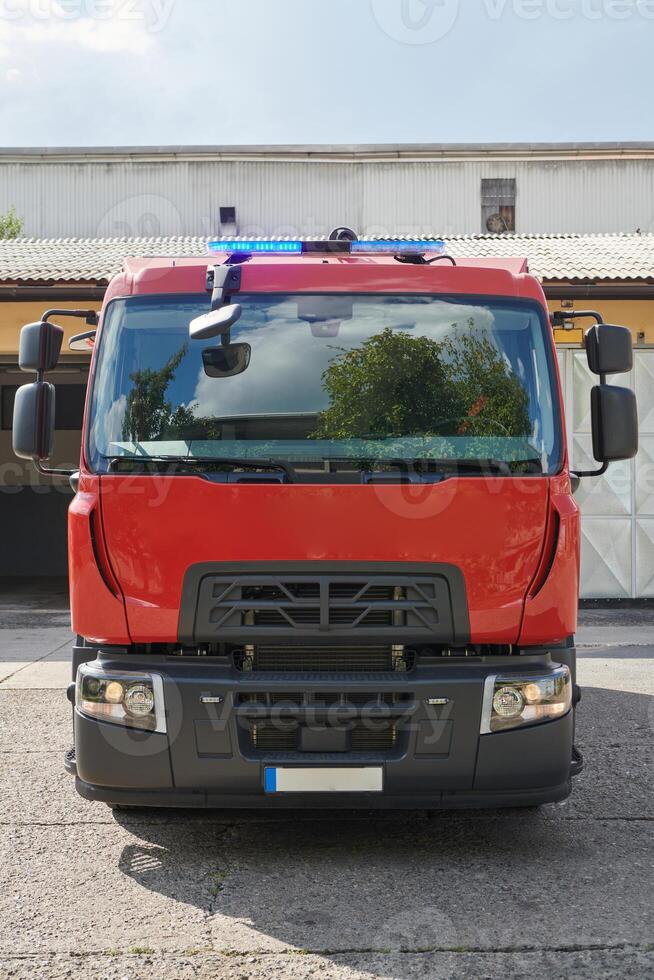 A state-of-the-art firetruck, equipped with advanced rescue technology, stands ready with its skilled firefighting team, prepared to intervene and respond rapidly to emergencies, ensuring the safety photo