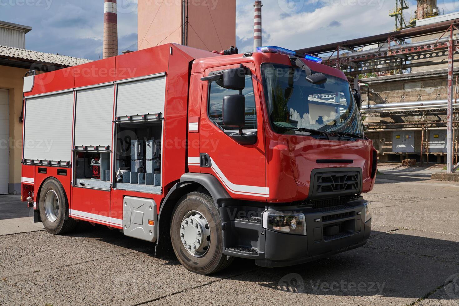 A state-of-the-art firetruck, equipped with advanced rescue technology, stands ready with its skilled firefighting team, prepared to intervene and respond rapidly to emergencies, ensuring the safety photo