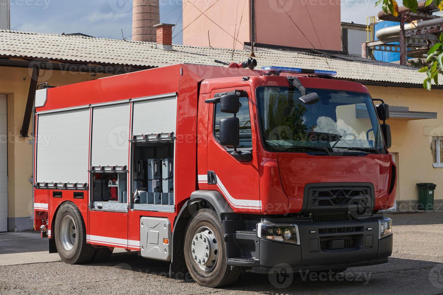 A state-of-the-art firetruck, equipped with advanced rescue technology, stands ready with its skilled firefighting team, prepared to intervene and respond rapidly to emergencies, ensuring the safety photo