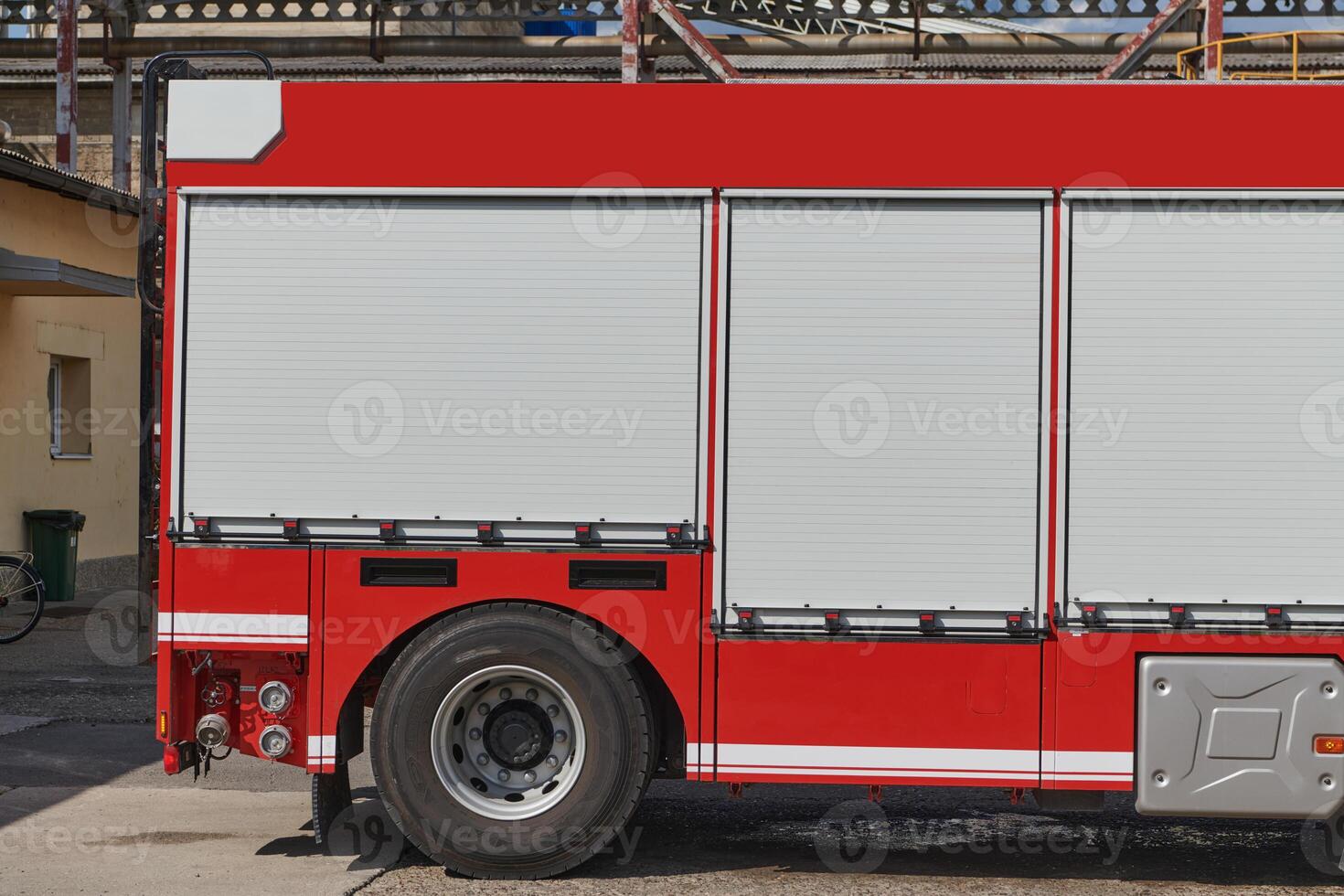 A state-of-the-art firetruck, equipped with advanced rescue technology, stands ready with its skilled firefighting team, prepared to intervene and respond rapidly to emergencies, ensuring the safety photo