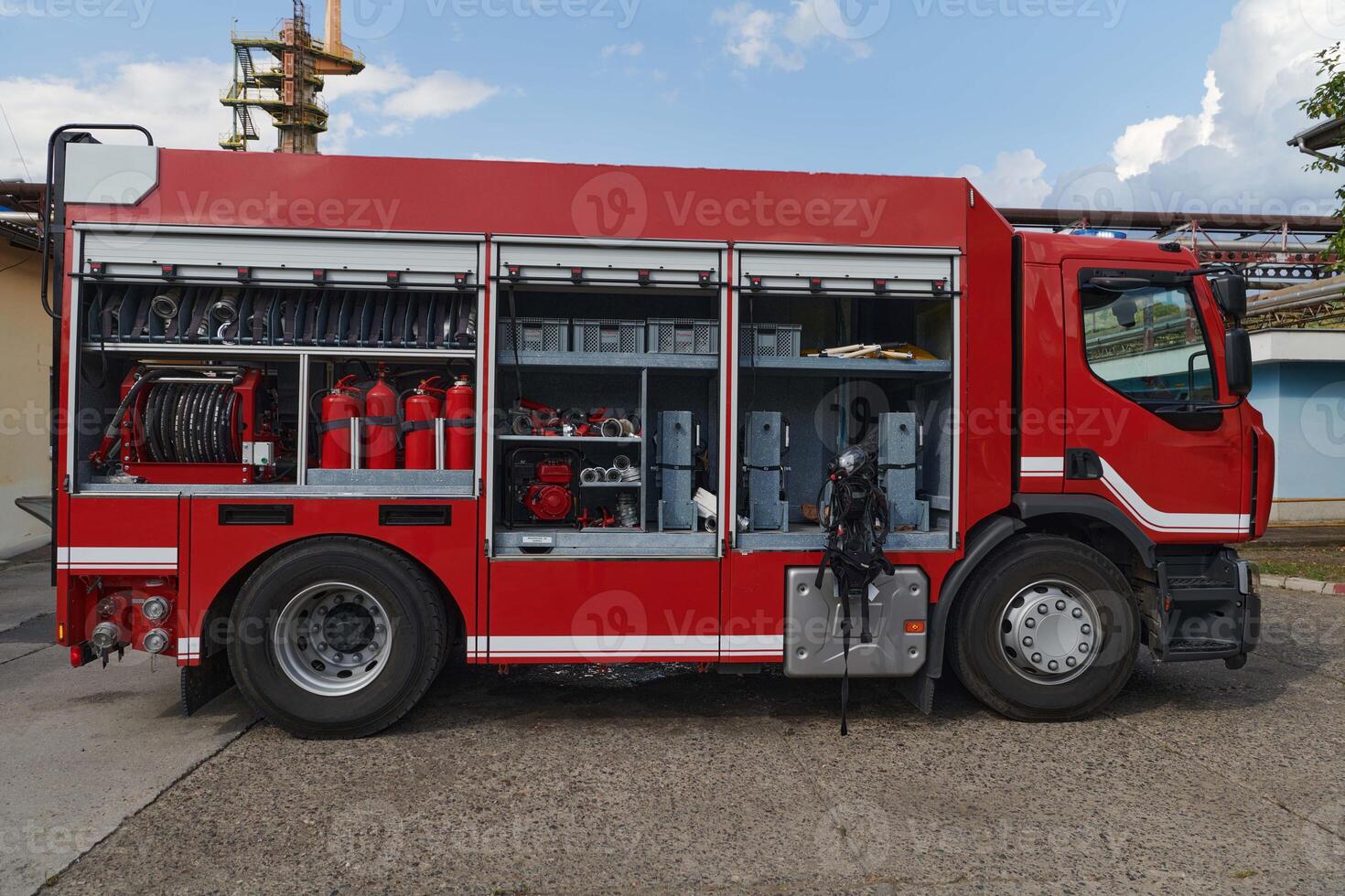 A state-of-the-art firetruck, equipped with advanced rescue technology, stands ready with its skilled firefighting team, prepared to intervene and respond rapidly to emergencies, ensuring the safety photo