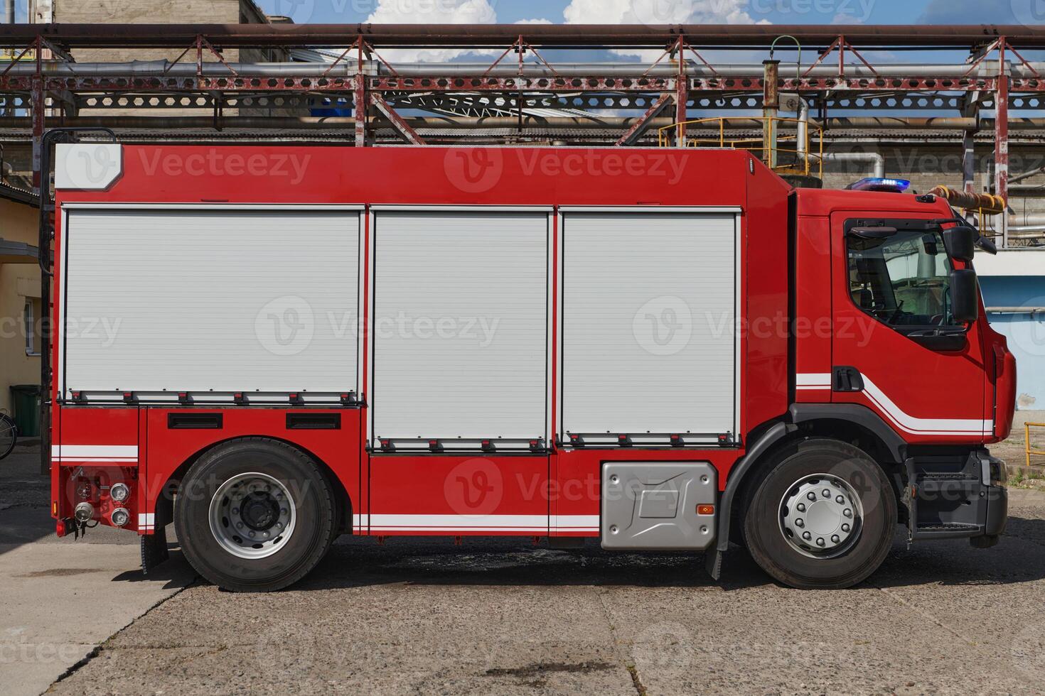 A state-of-the-art firetruck, equipped with advanced rescue technology, stands ready with its skilled firefighting team, prepared to intervene and respond rapidly to emergencies, ensuring the safety photo