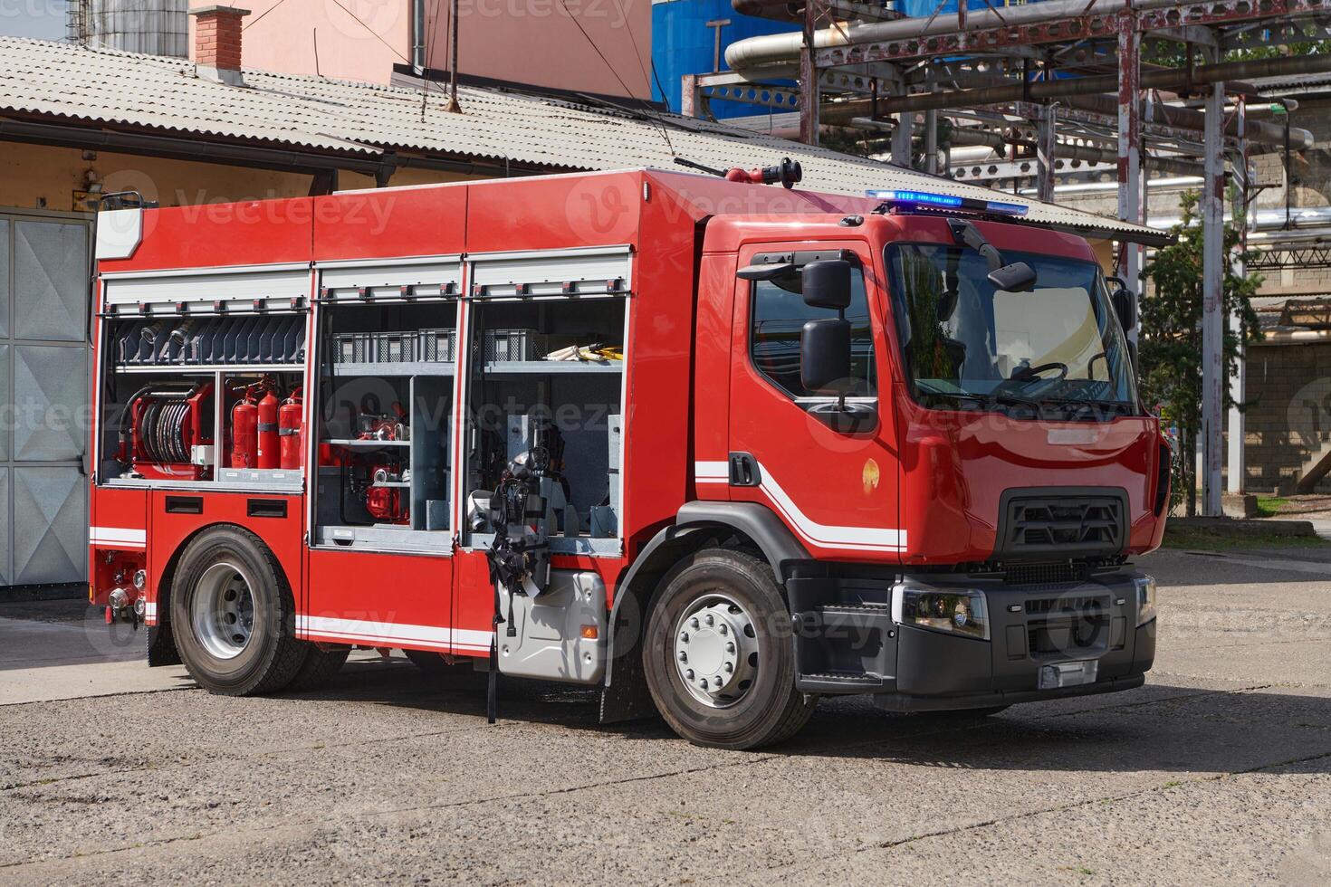 A state-of-the-art firetruck, equipped with advanced rescue technology, stands ready with its skilled firefighting team, prepared to intervene and respond rapidly to emergencies, ensuring the safety photo