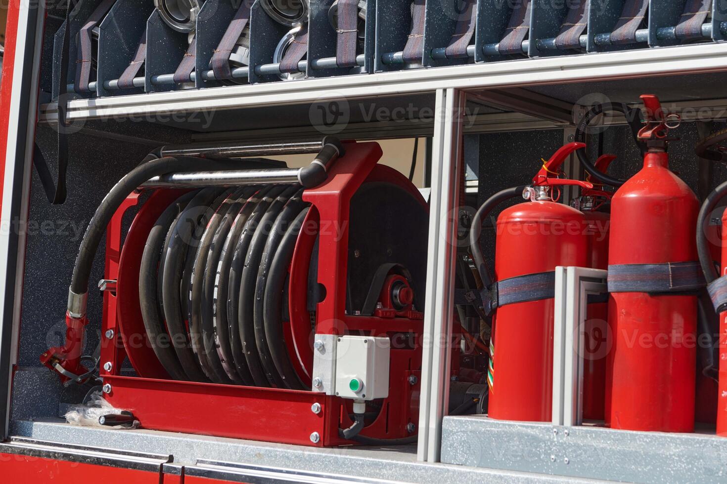 Close-up of essential firefighting equipment on a modern firetruck, showcasing tools and gear ready for emergency response to hazardous fire situations photo