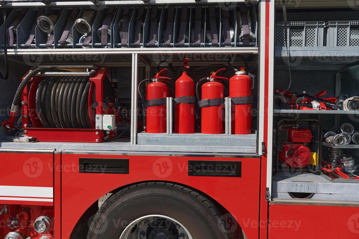 A state-of-the-art firetruck, equipped with advanced rescue technology, stands ready with its skilled firefighting team, prepared to intervene and respond rapidly to emergencies, ensuring the safety photo