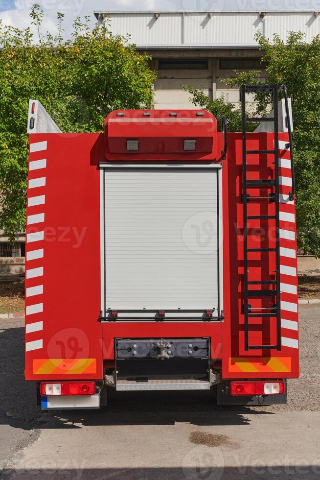 A state-of-the-art firetruck, equipped with advanced rescue technology, stands ready with its skilled firefighting team, prepared to intervene and respond rapidly to emergencies, ensuring the safety photo