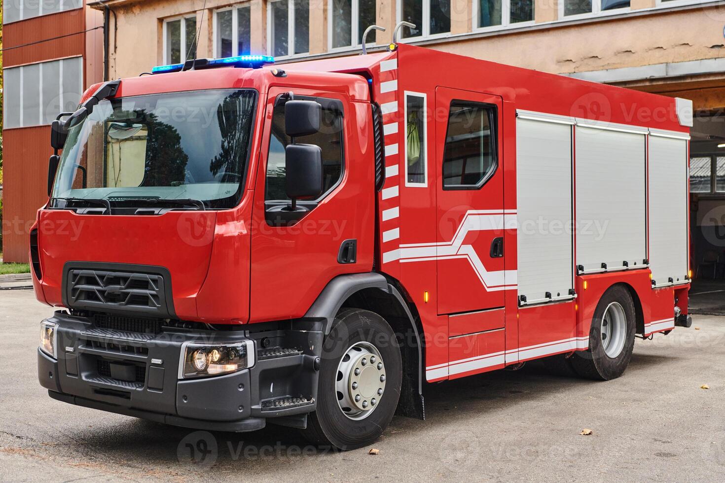 A state-of-the-art firetruck, equipped with advanced rescue technology, stands ready with its skilled firefighting team, prepared to intervene and respond rapidly to emergencies, ensuring the safety photo