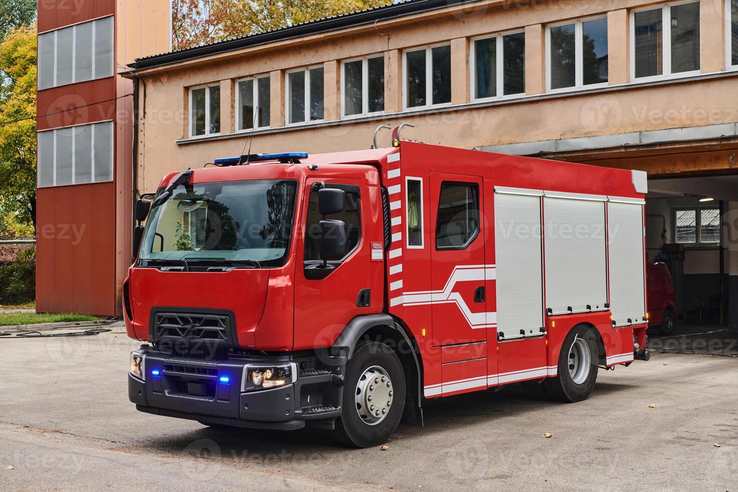 A state-of-the-art firetruck, equipped with advanced rescue technology, stands ready with its skilled firefighting team, prepared to intervene and respond rapidly to emergencies, ensuring the safety photo