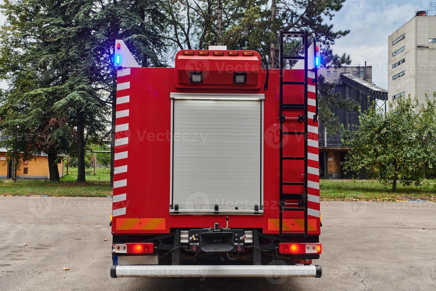 A state-of-the-art firetruck, equipped with advanced rescue technology, stands ready with its skilled firefighting team, prepared to intervene and respond rapidly to emergencies, ensuring the safety photo