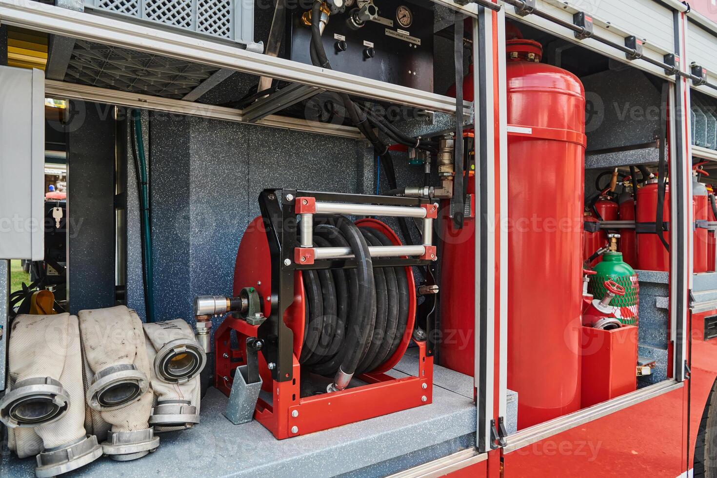 Close-up of essential firefighting equipment on a modern firetruck, showcasing tools and gear ready for emergency response to hazardous fire situations photo