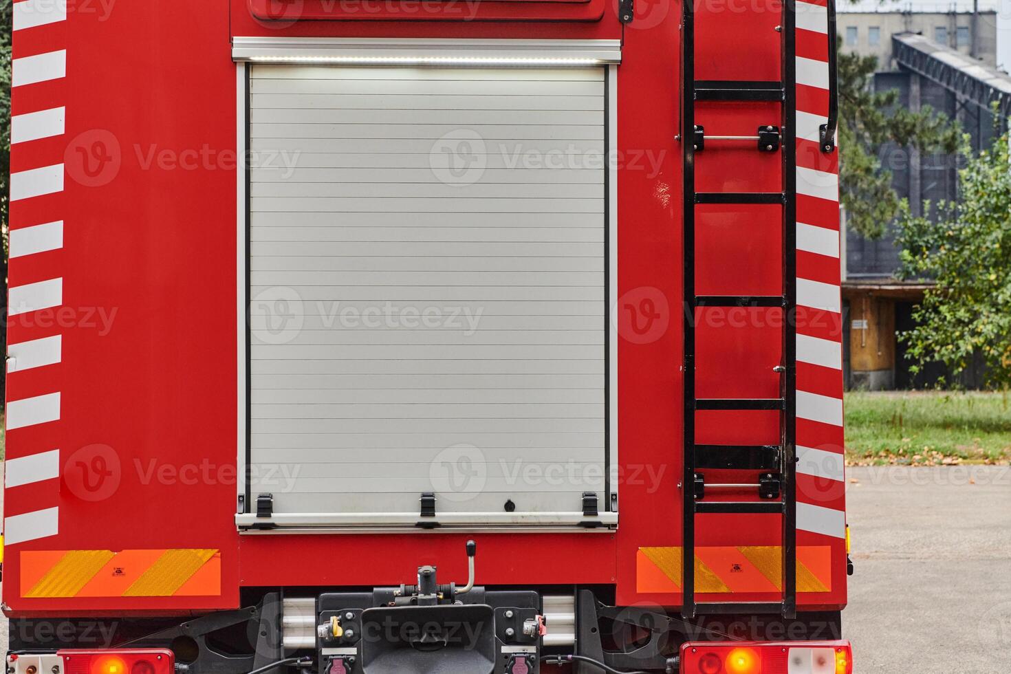 A state-of-the-art firetruck, equipped with advanced rescue technology, stands ready with its skilled firefighting team, prepared to intervene and respond rapidly to emergencies, ensuring the safety photo