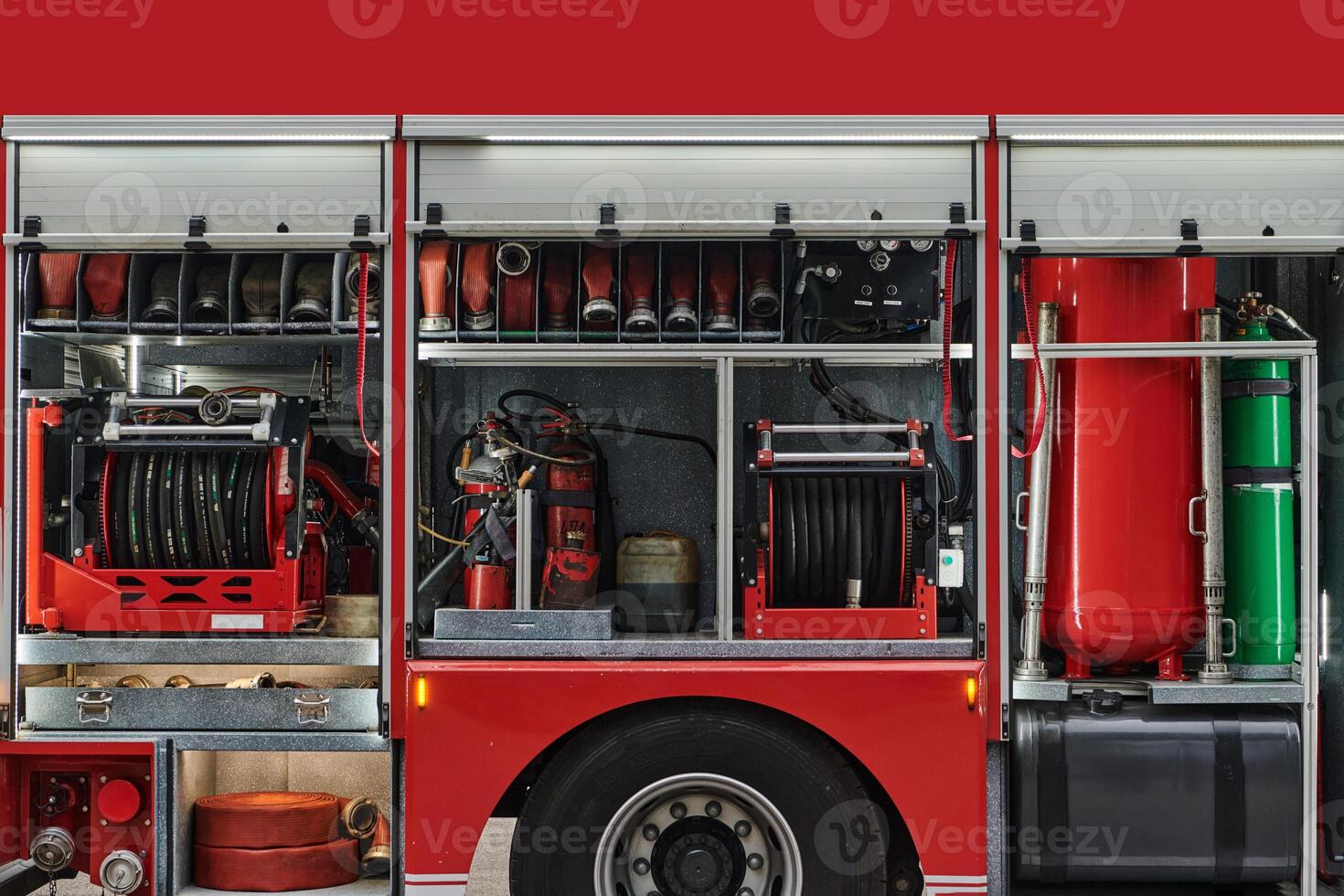 A state-of-the-art firetruck, equipped with advanced rescue technology, stands ready with its skilled firefighting team, prepared to intervene and respond rapidly to emergencies, ensuring the safety photo