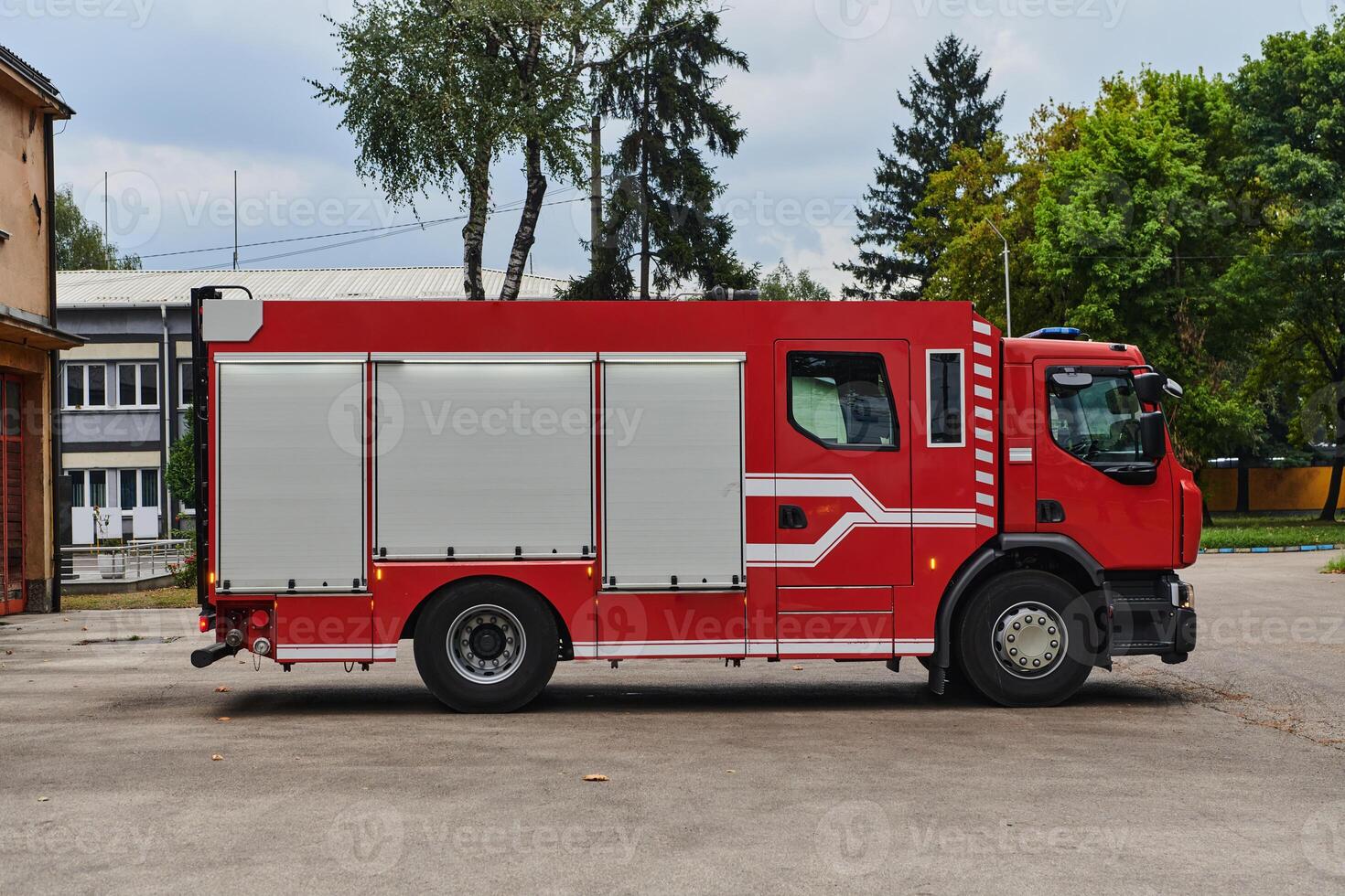 A state-of-the-art firetruck, equipped with advanced rescue technology, stands ready with its skilled firefighting team, prepared to intervene and respond rapidly to emergencies, ensuring the safety photo