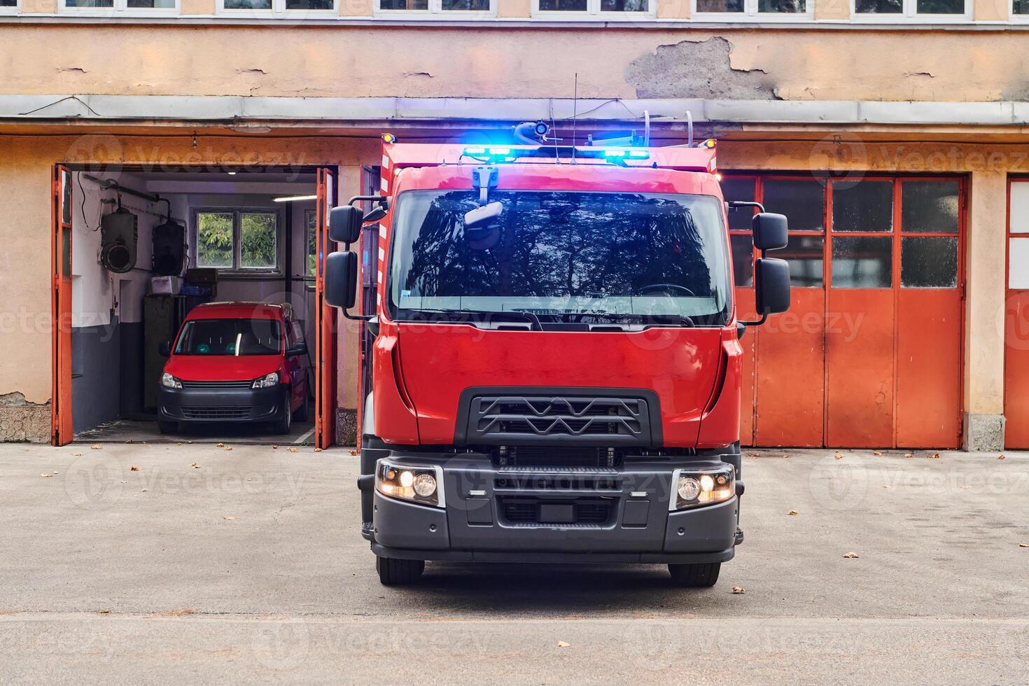 A state-of-the-art firetruck, equipped with advanced rescue technology, stands ready with its skilled firefighting team, prepared to intervene and respond rapidly to emergencies, ensuring the safety photo