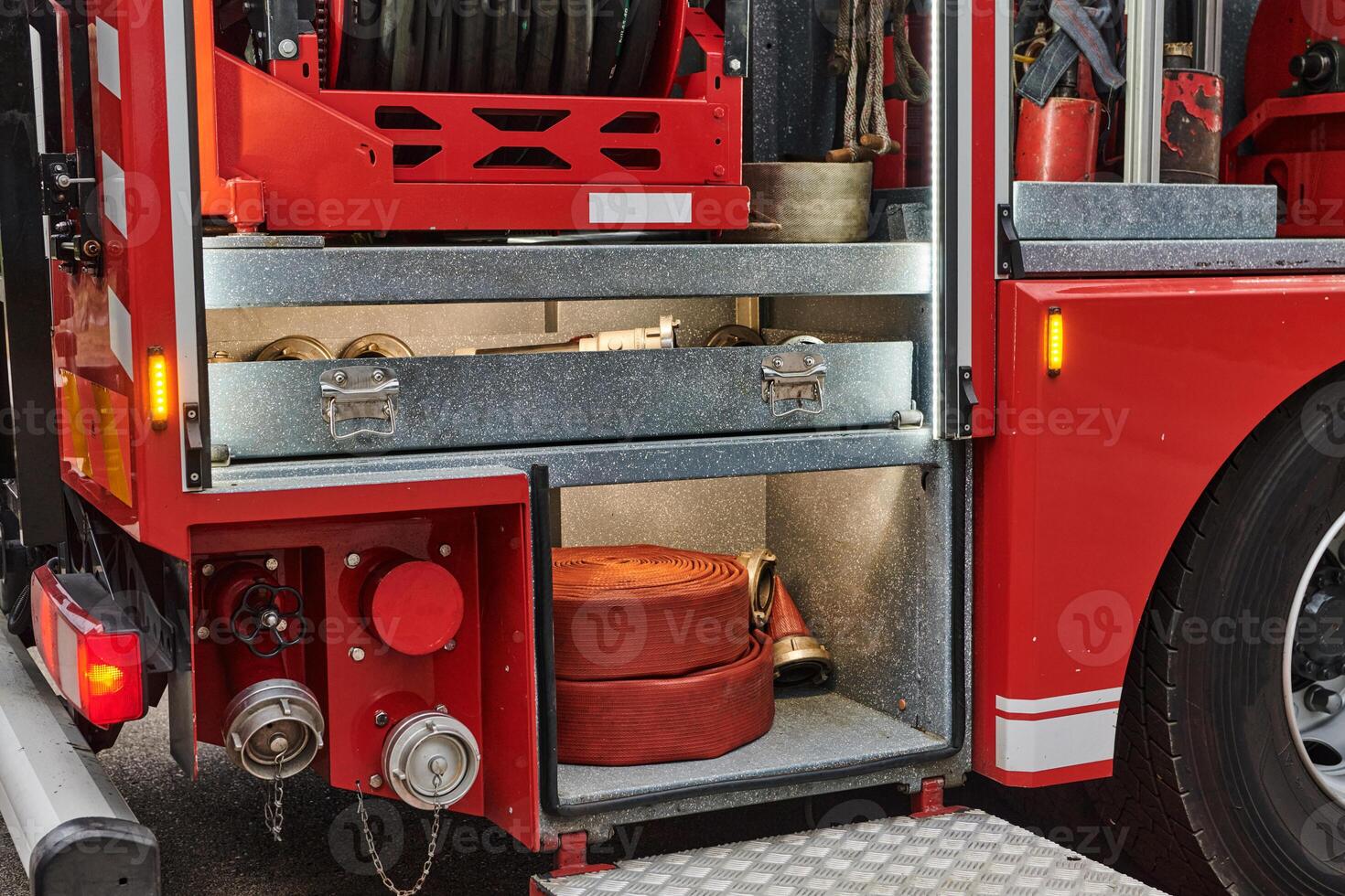 Close-up of essential firefighting equipment on a modern firetruck, showcasing tools and gear ready for emergency response to hazardous fire situations photo