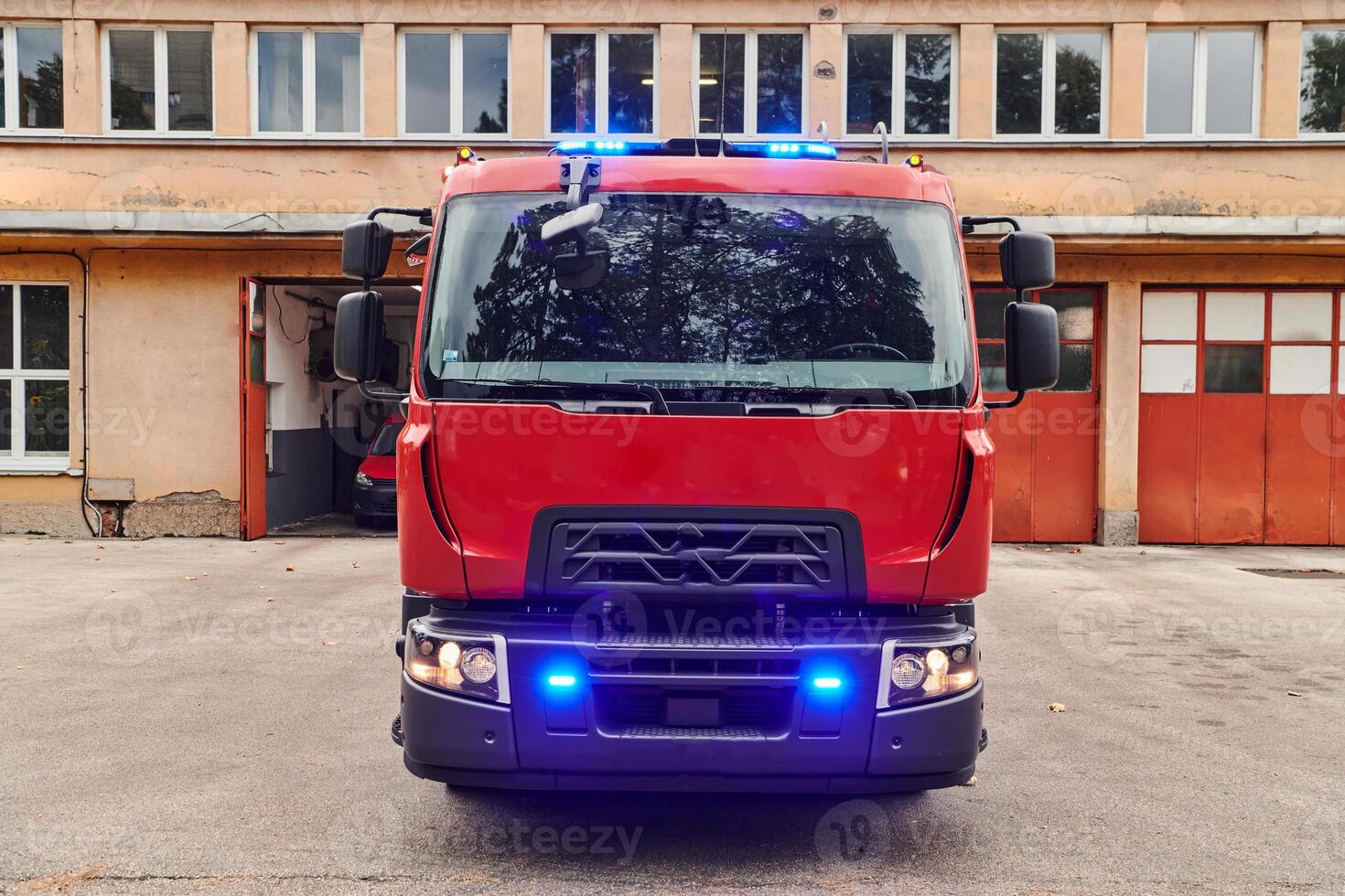 A state-of-the-art firetruck, equipped with advanced rescue technology, stands ready with its skilled firefighting team, prepared to intervene and respond rapidly to emergencies, ensuring the safety photo