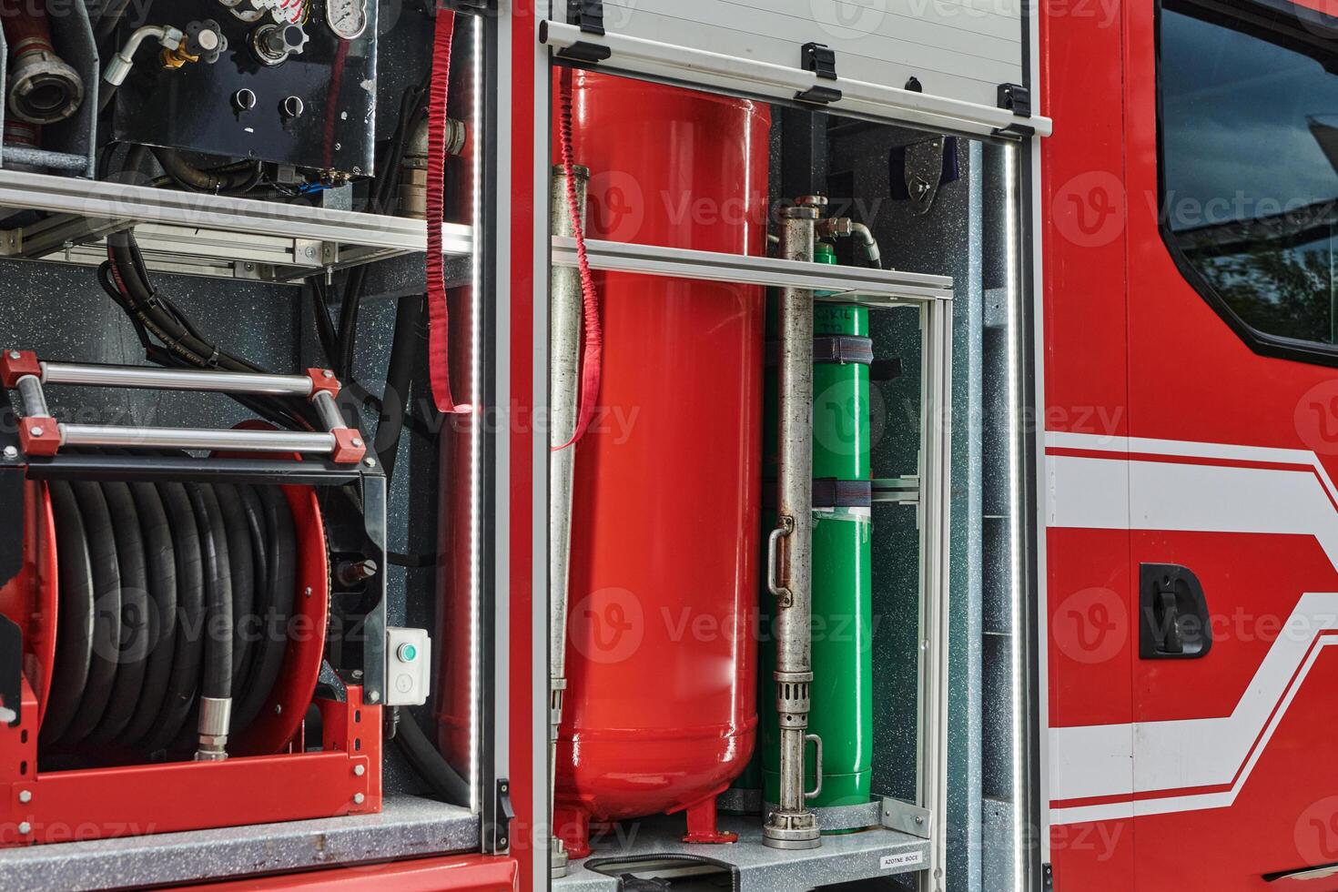Close-up of essential firefighting equipment on a modern firetruck, showcasing tools and gear ready for emergency response to hazardous fire situations photo