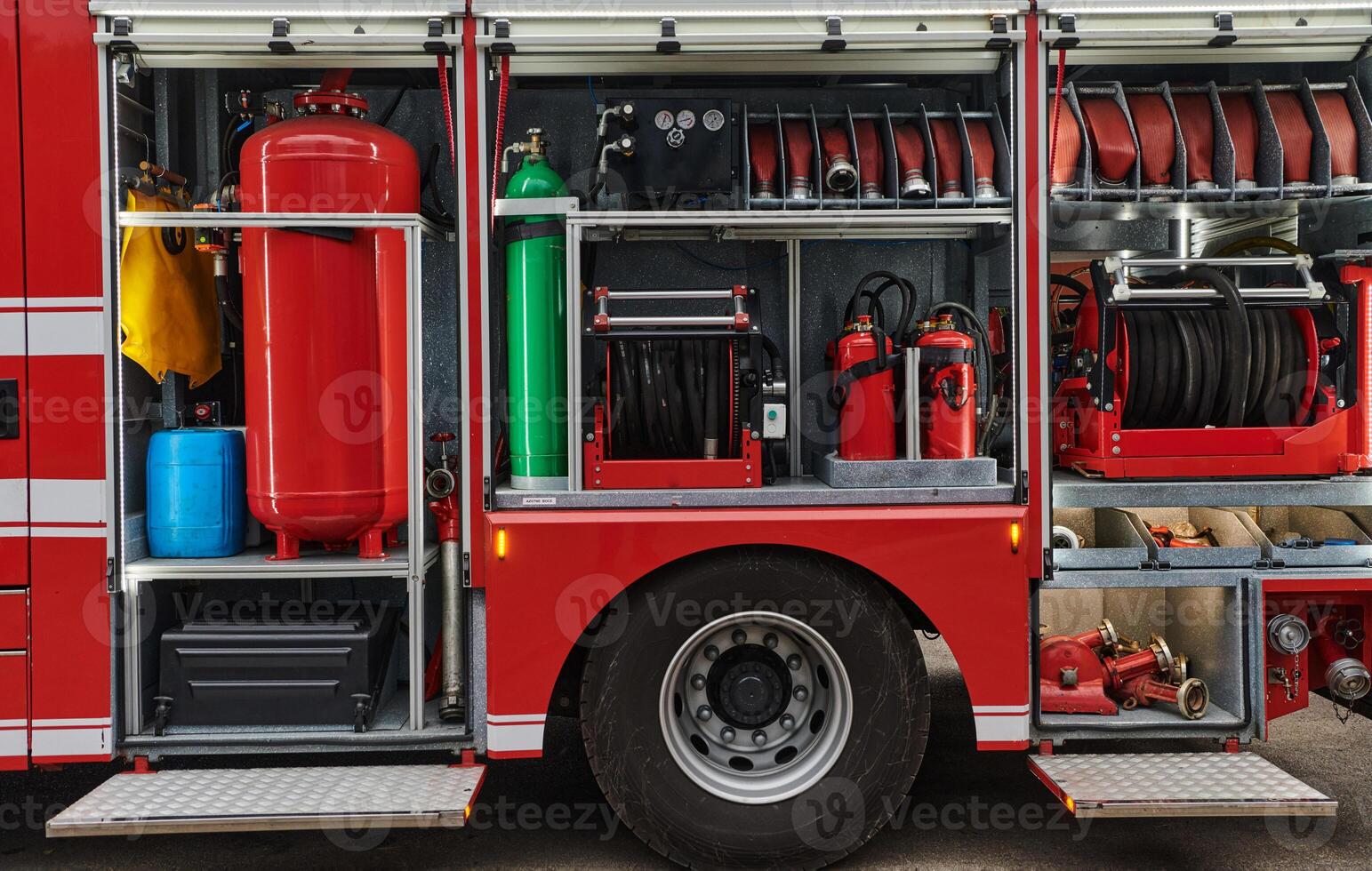 A state-of-the-art firetruck, equipped with advanced rescue technology, stands ready with its skilled firefighting team, prepared to intervene and respond rapidly to emergencies, ensuring the safety photo