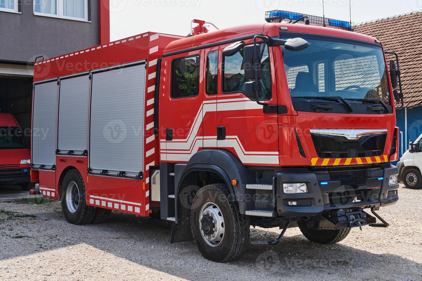 A state-of-the-art firetruck, equipped with advanced rescue technology, stands ready with its skilled firefighting team, prepared to intervene and respond rapidly to emergencies, ensuring the safety photo