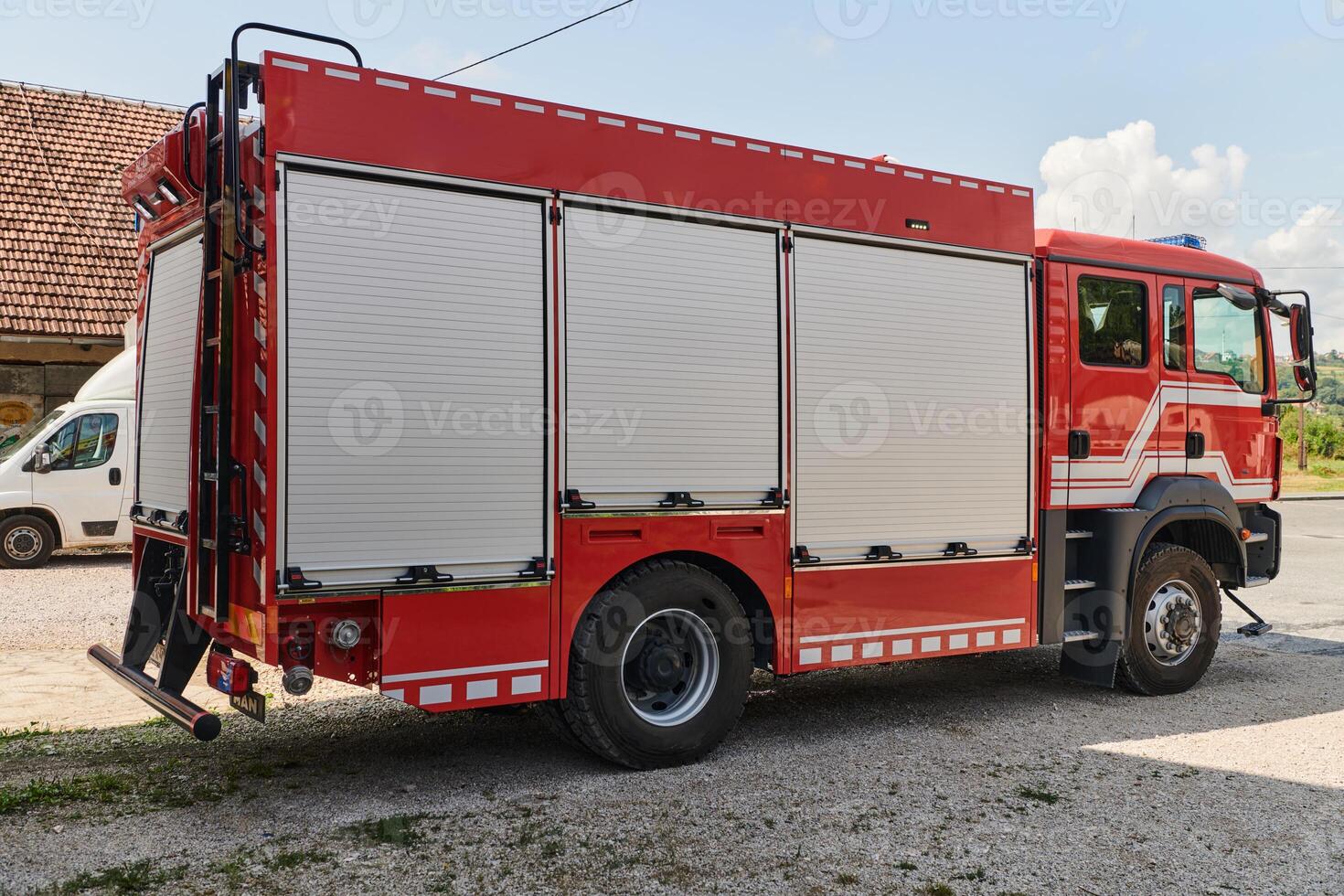 A state-of-the-art firetruck, equipped with advanced rescue technology, stands ready with its skilled firefighting team, prepared to intervene and respond rapidly to emergencies, ensuring the safety photo