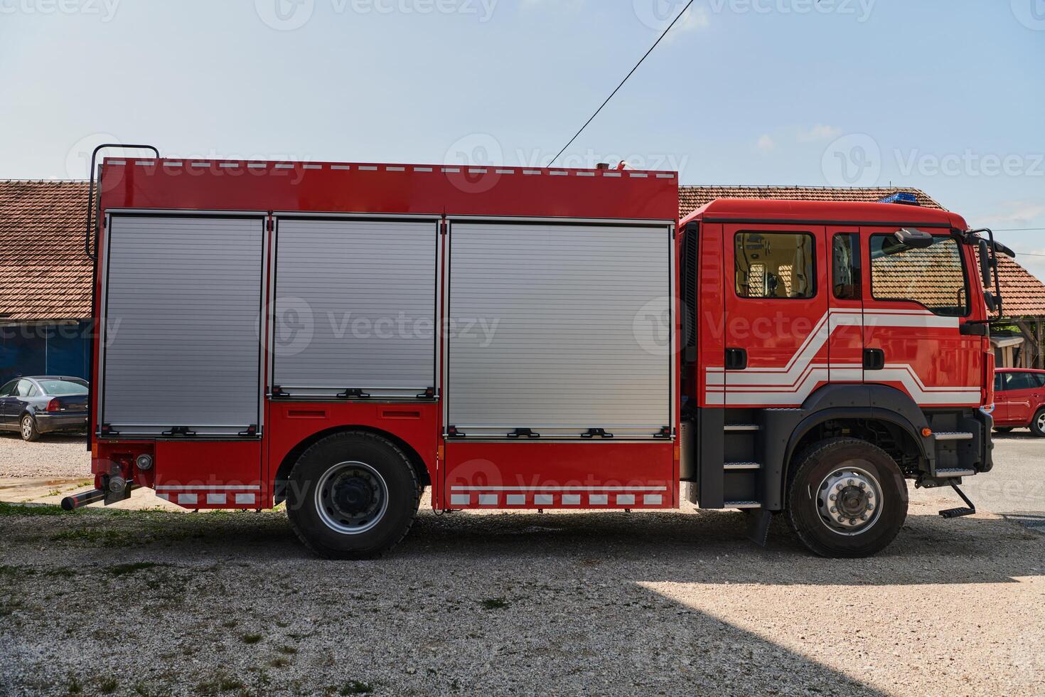 A state-of-the-art firetruck, equipped with advanced rescue technology, stands ready with its skilled firefighting team, prepared to intervene and respond rapidly to emergencies, ensuring the safety photo