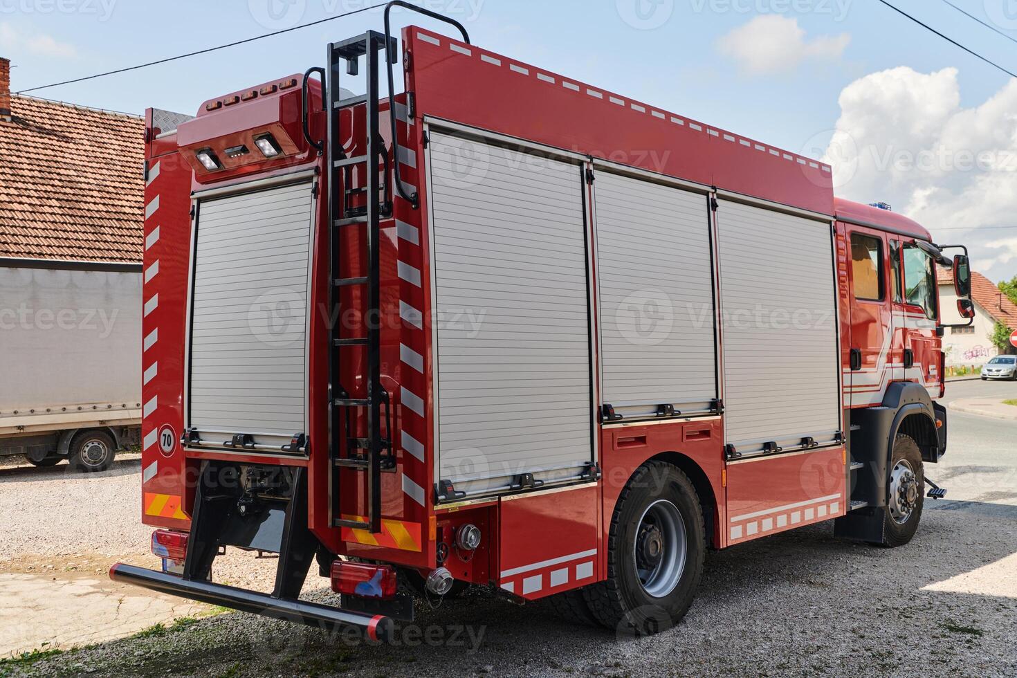 A state-of-the-art firetruck, equipped with advanced rescue technology, stands ready with its skilled firefighting team, prepared to intervene and respond rapidly to emergencies, ensuring the safety photo
