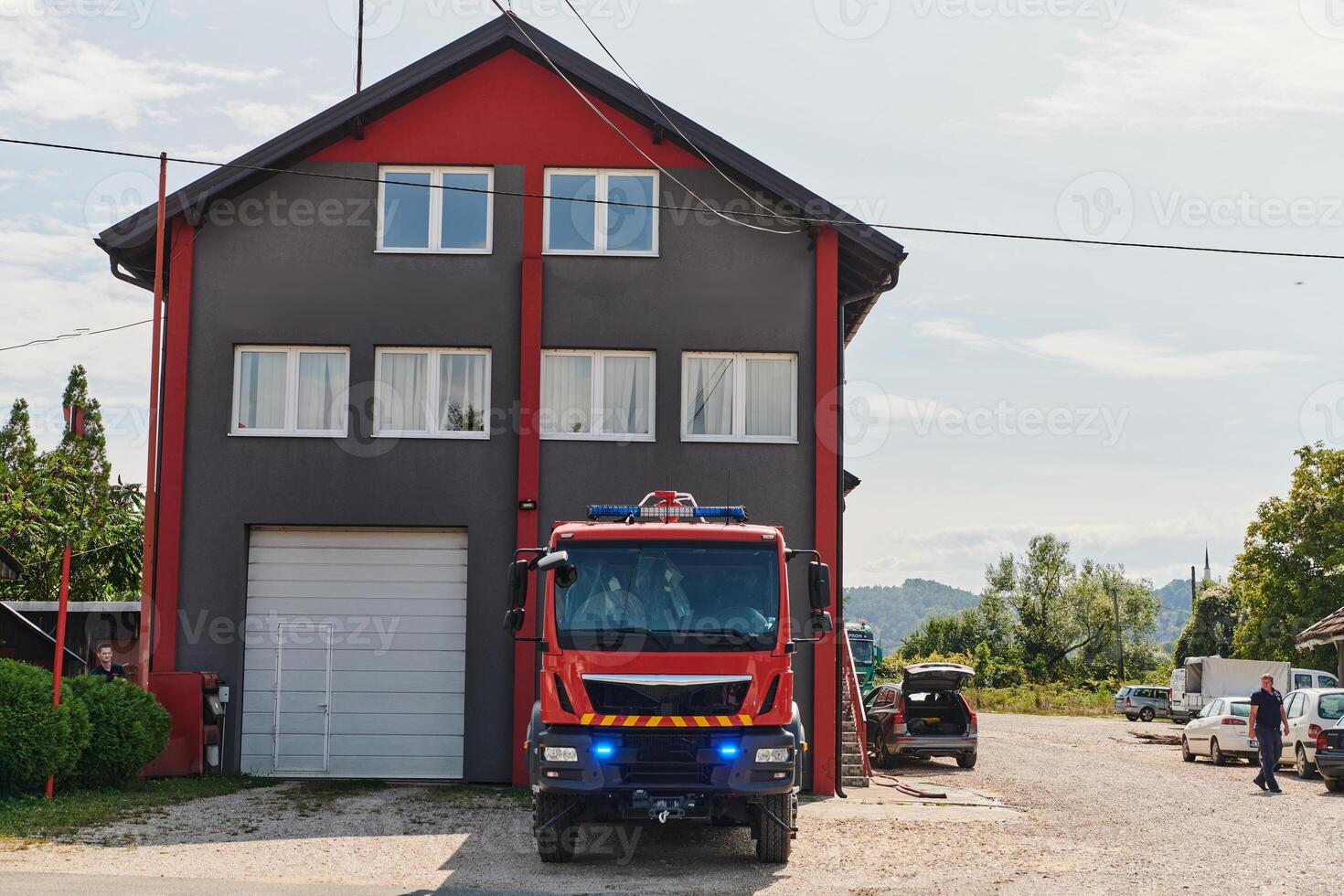 A state-of-the-art firetruck, equipped with advanced rescue technology, stands ready with its skilled firefighting team, prepared to intervene and respond rapidly to emergencies, ensuring the safety photo