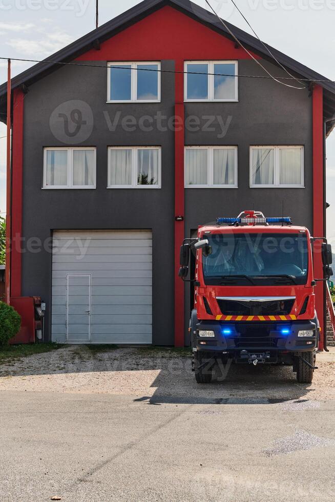 A state-of-the-art firetruck, equipped with advanced rescue technology, stands ready with its skilled firefighting team, prepared to intervene and respond rapidly to emergencies, ensuring the safety photo