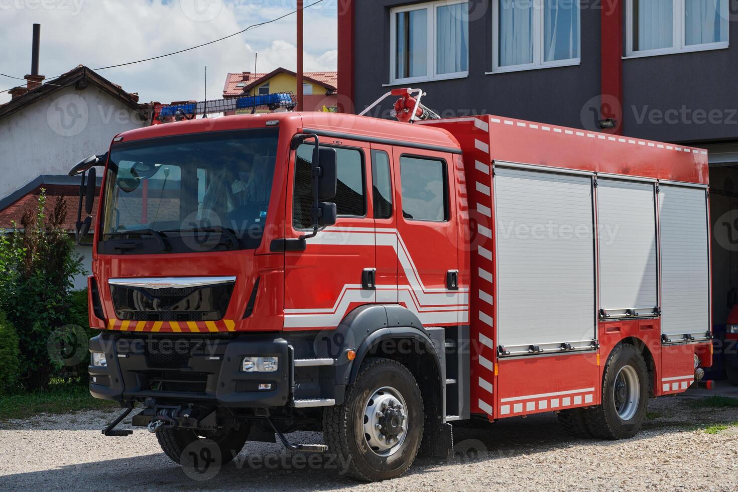 A state-of-the-art firetruck, equipped with advanced rescue technology, stands ready with its skilled firefighting team, prepared to intervene and respond rapidly to emergencies, ensuring the safety photo