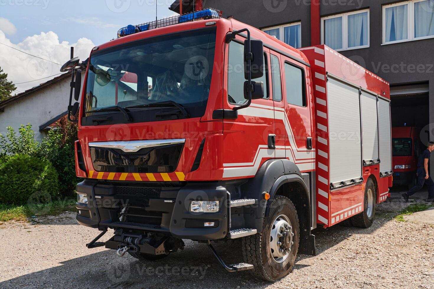 A state-of-the-art firetruck, equipped with advanced rescue technology, stands ready with its skilled firefighting team, prepared to intervene and respond rapidly to emergencies, ensuring the safety photo