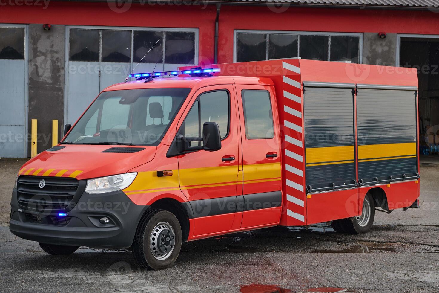 A state-of-the-art firetruck, equipped with advanced rescue technology, stands ready with its skilled firefighting team, prepared to intervene and respond rapidly to emergencies, ensuring the safety photo