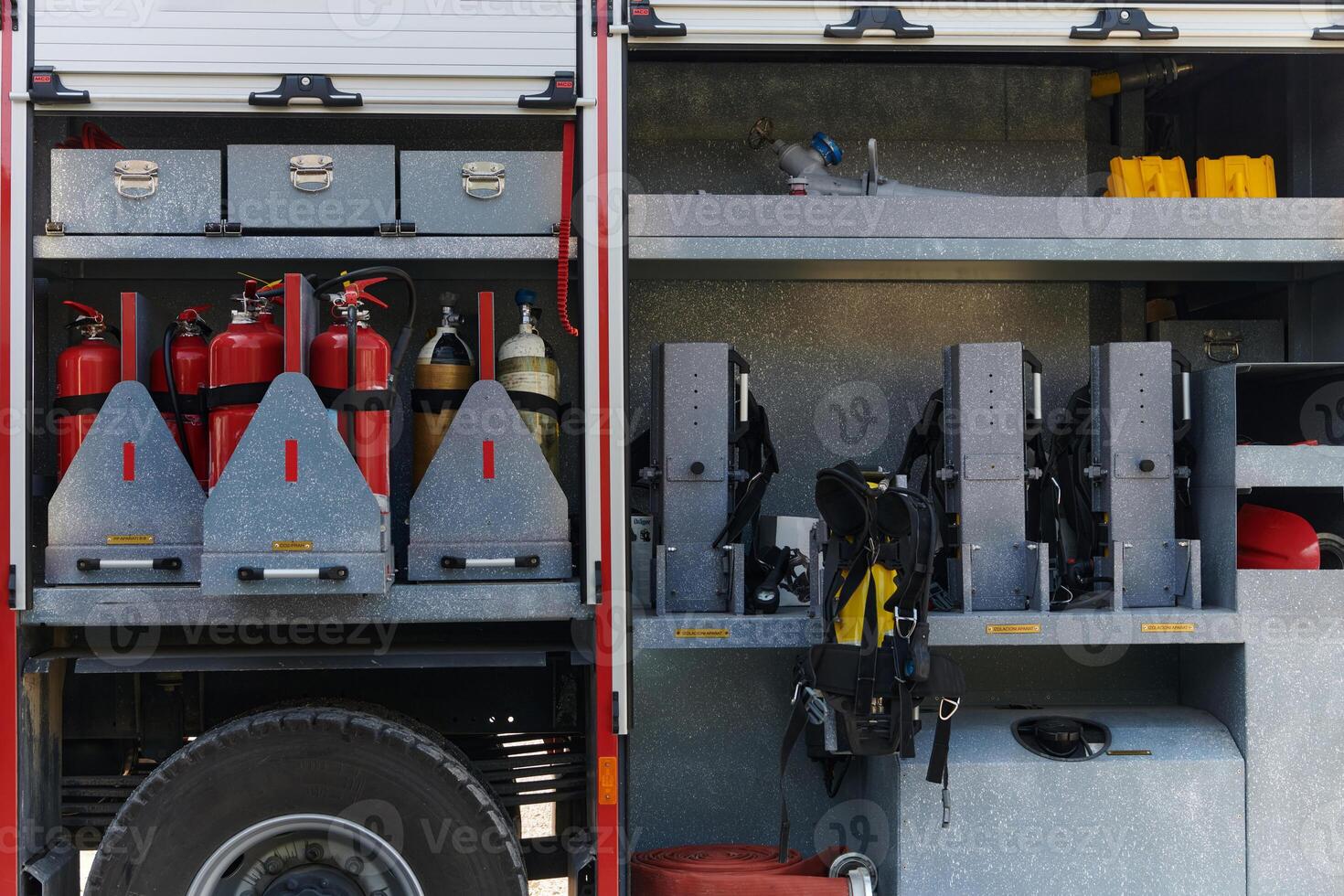 Close-up of essential firefighting equipment on a modern firetruck, showcasing tools and gear ready for emergency response to hazardous fire situations photo