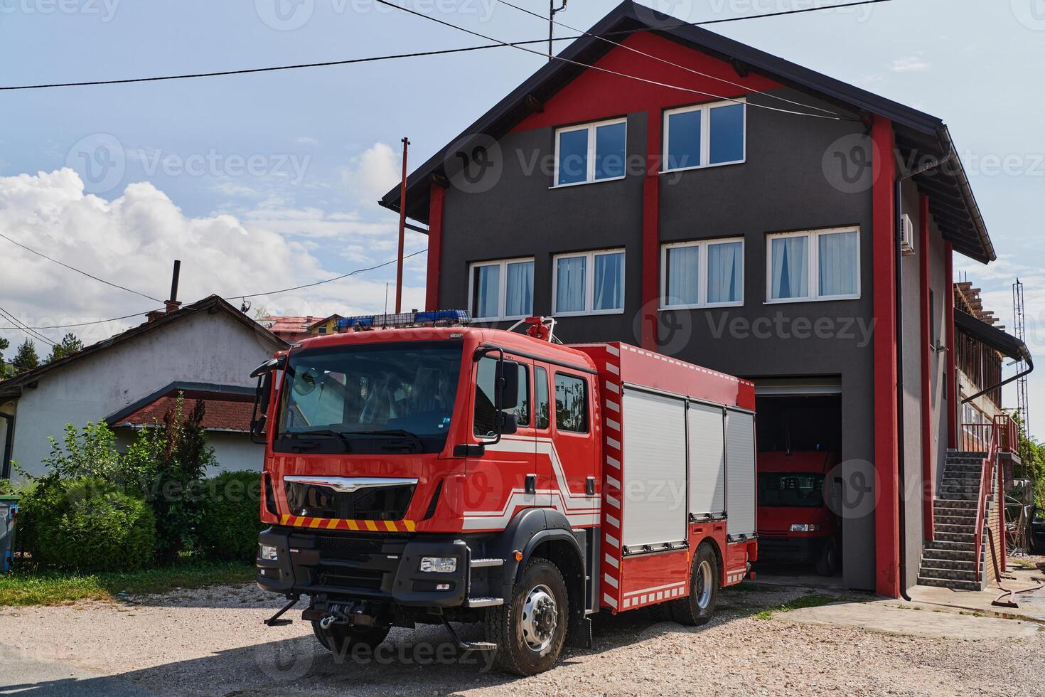 A state-of-the-art firetruck, equipped with advanced rescue technology, stands ready with its skilled firefighting team, prepared to intervene and respond rapidly to emergencies, ensuring the safety photo