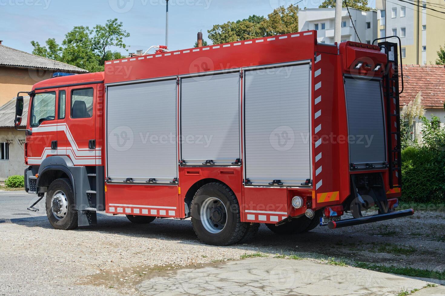 A state-of-the-art firetruck, equipped with advanced rescue technology, stands ready with its skilled firefighting team, prepared to intervene and respond rapidly to emergencies, ensuring the safety photo