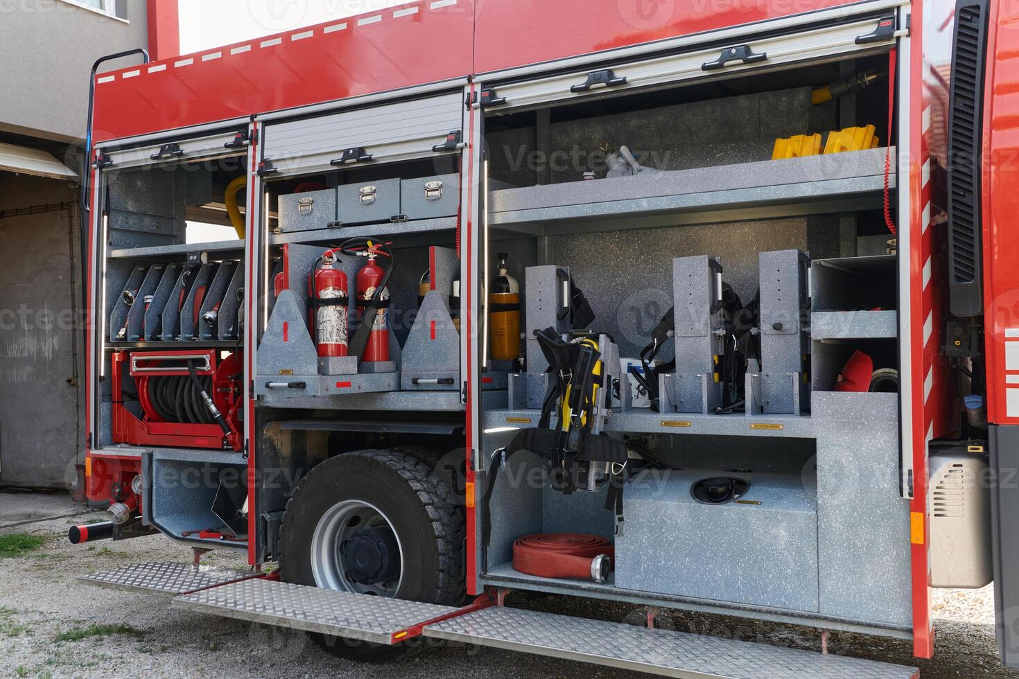 Close-up of essential firefighting equipment on a modern firetruck, showcasing tools and gear ready for emergency response to hazardous fire situations photo