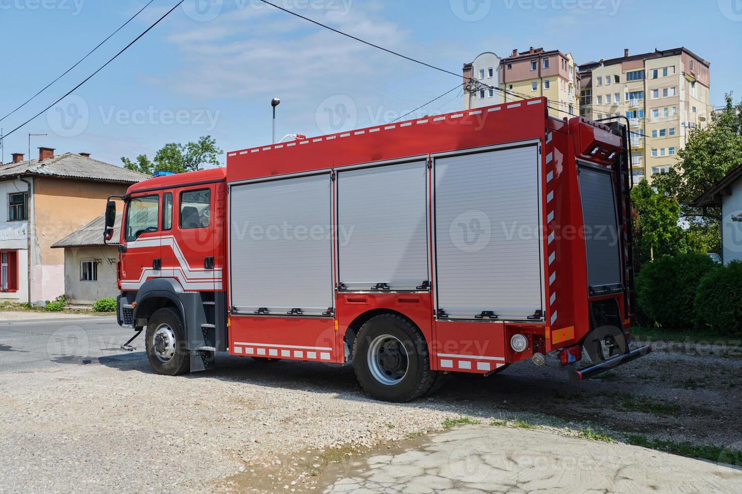 A state-of-the-art firetruck, equipped with advanced rescue technology, stands ready with its skilled firefighting team, prepared to intervene and respond rapidly to emergencies, ensuring the safety photo