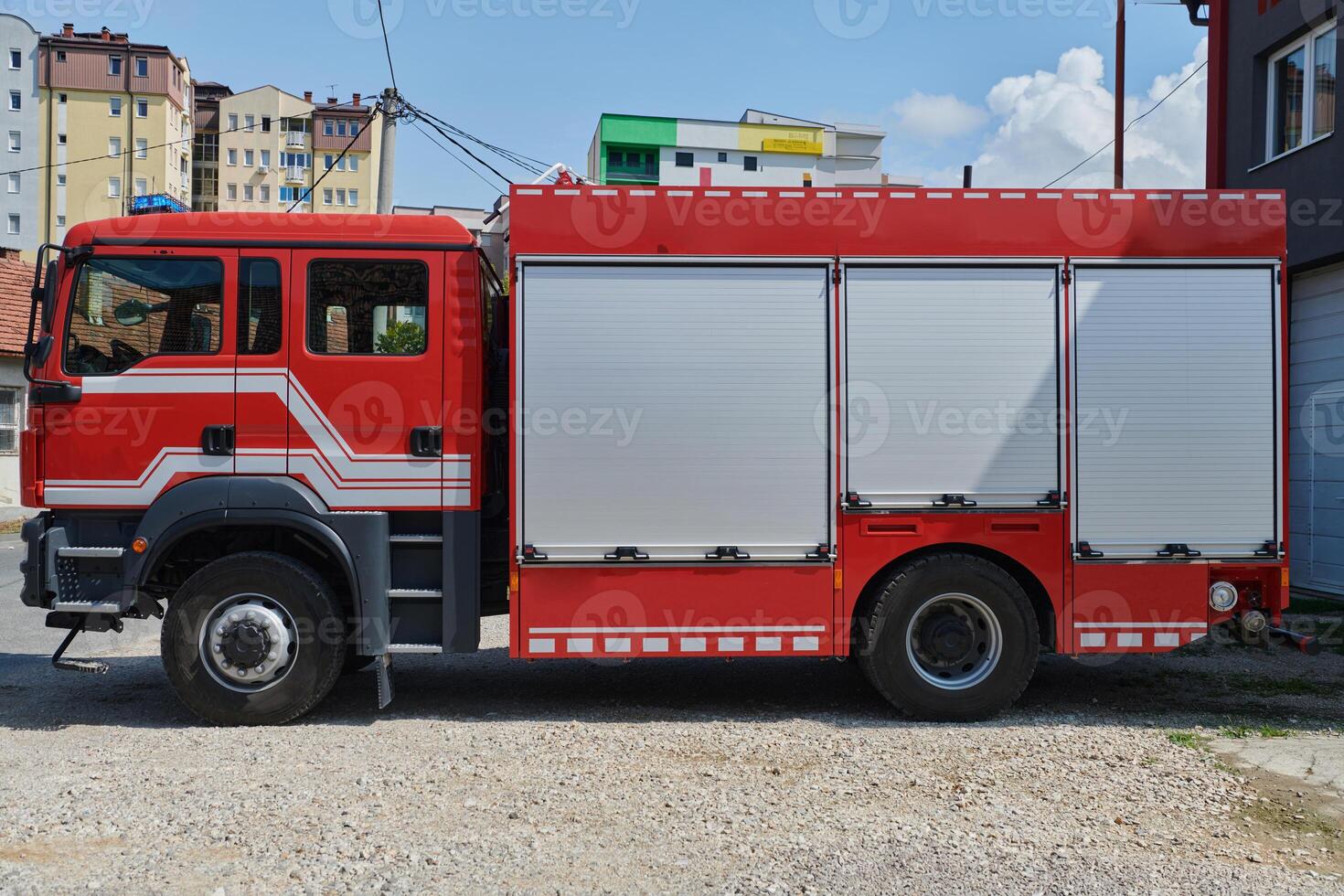 A state-of-the-art firetruck, equipped with advanced rescue technology, stands ready with its skilled firefighting team, prepared to intervene and respond rapidly to emergencies, ensuring the safety photo