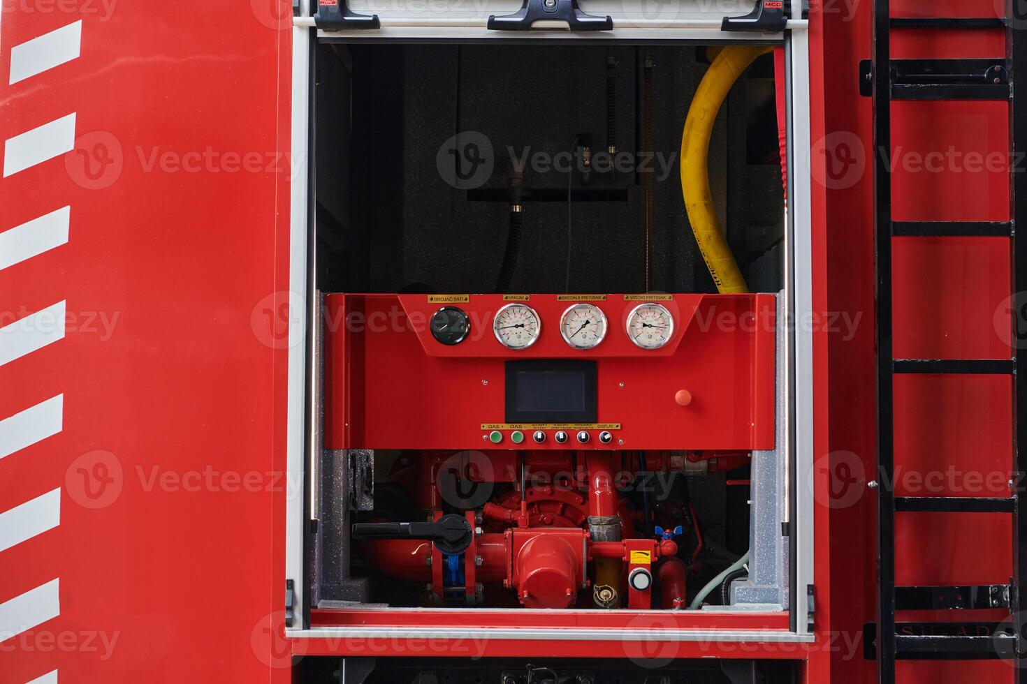 Close-up of essential firefighting equipment on a modern firetruck, showcasing tools and gear ready for emergency response to hazardous fire situations photo
